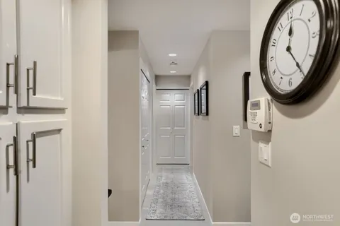 a view of a hallway with washer and dryer