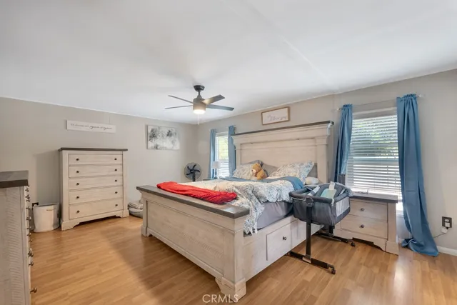 a bed room with a bed and a window