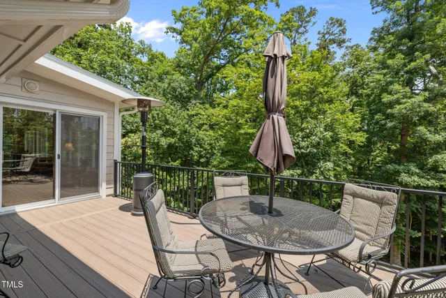 a bedroom with a bed and a chair