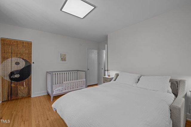 a bedroom with a bed and a chair