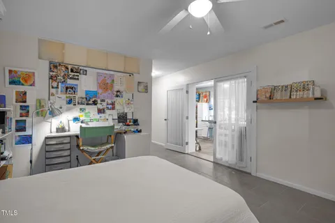 a room that has a bed and a desk in it