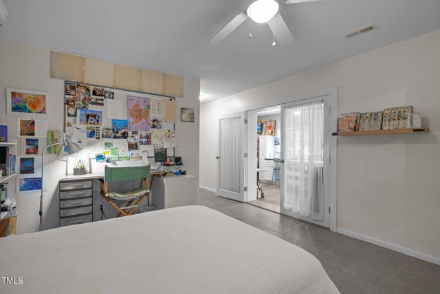 a room that has a bed and a desk in it