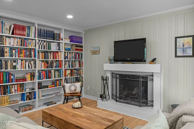 a large kitchen with a table and chairs