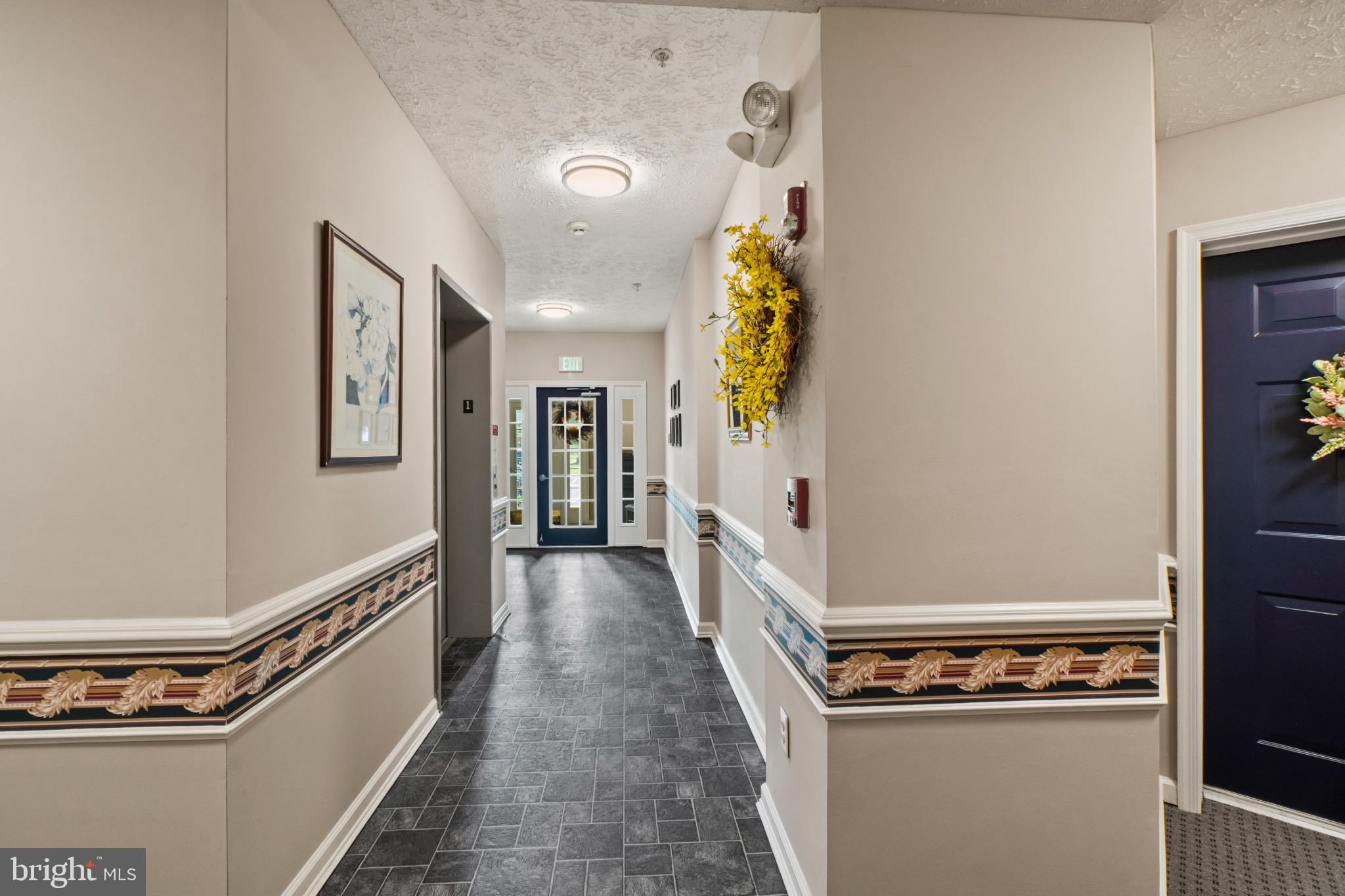 5144 Brightleaf Court, Unit 5144 Rosedale, MD 21237 - Photo 28 of 35 Inviting hallway with charming decor.