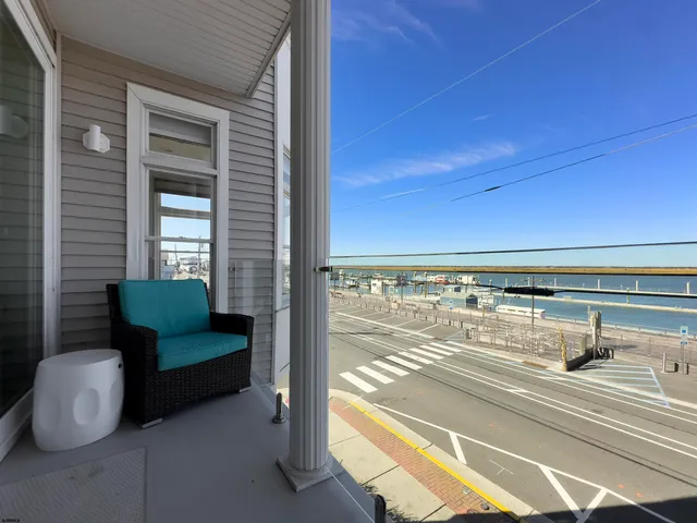 a dining room with wooden floor and a window