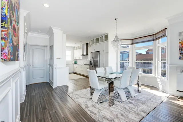 a kitchen with stainless steel appliances a refrigerator sink and cabinets