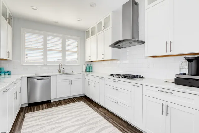 a bedroom with a large bed and a flat screen tv