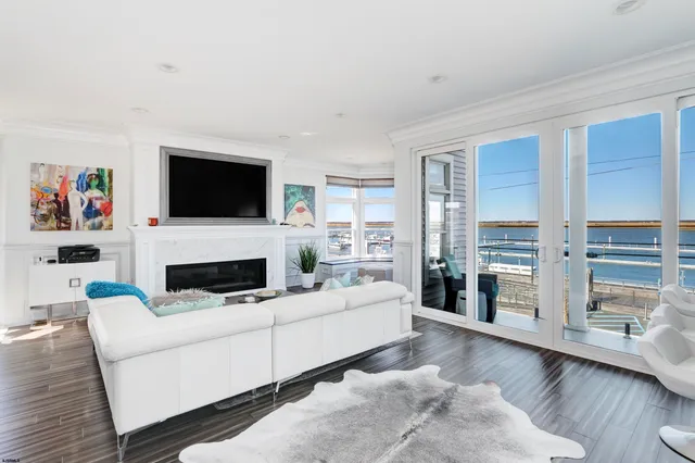 a living room with fireplace furniture and a flat screen tv