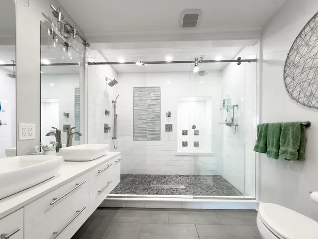 a bedroom with bed tv and table