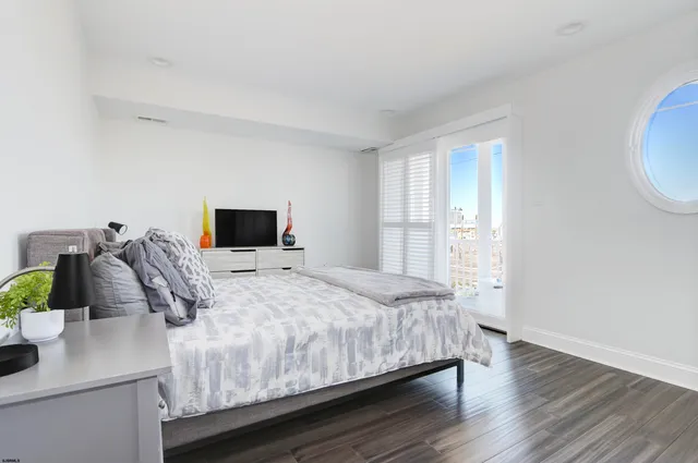 a bathroom with a toilet sink and shower
