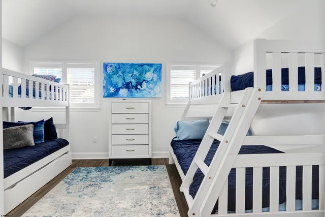 a view of a hallway with closet and bathroom
