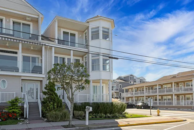 an aerial view of a house with a ocean view