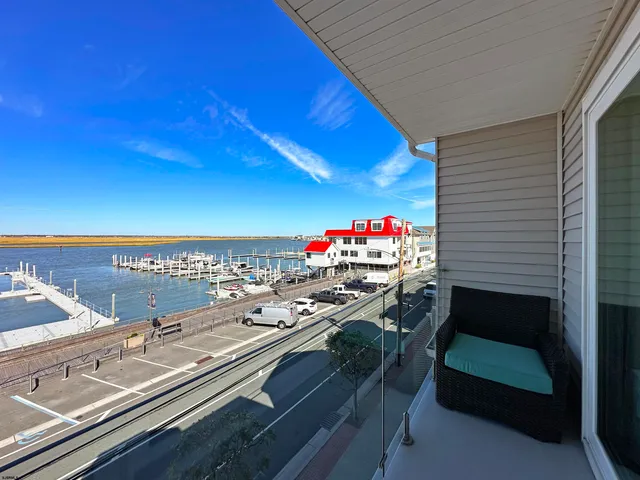 a view of a balcony with chair and a table