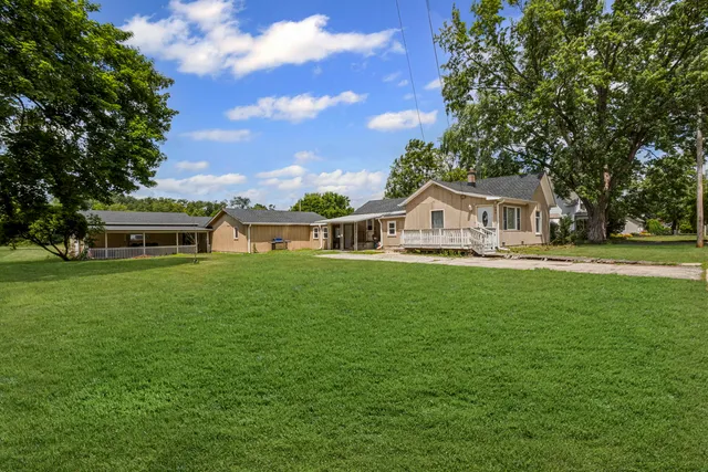 a front view of a house with garden