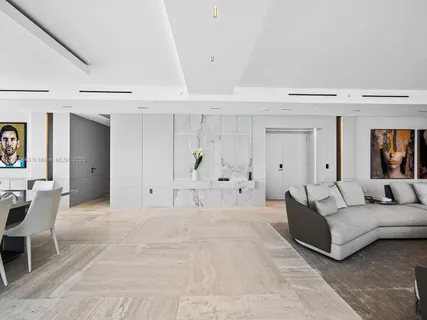 a view of a dining room with furniture wooden floor and chandelier