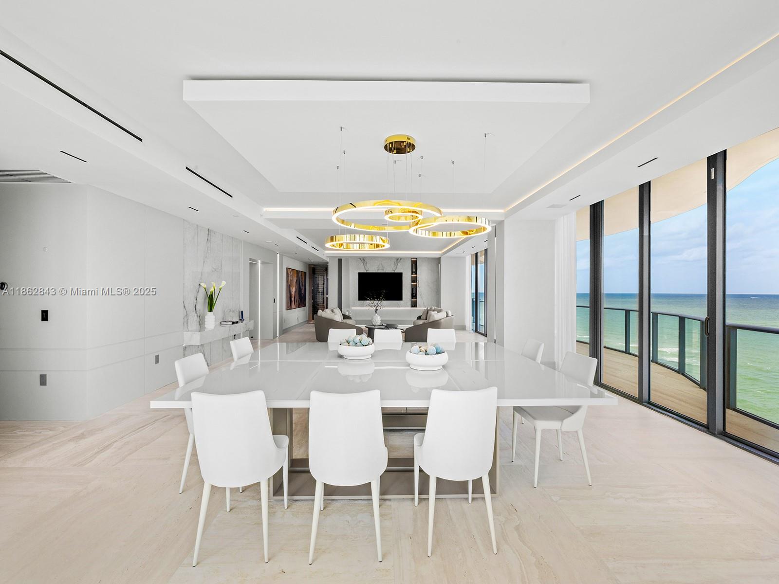 19575 Collins Avenue, Unit 9 Sunny Isles Beach, FL 33160 - Photo 18 of 91 a view of a dining room with furniture wooden floor and chandelier