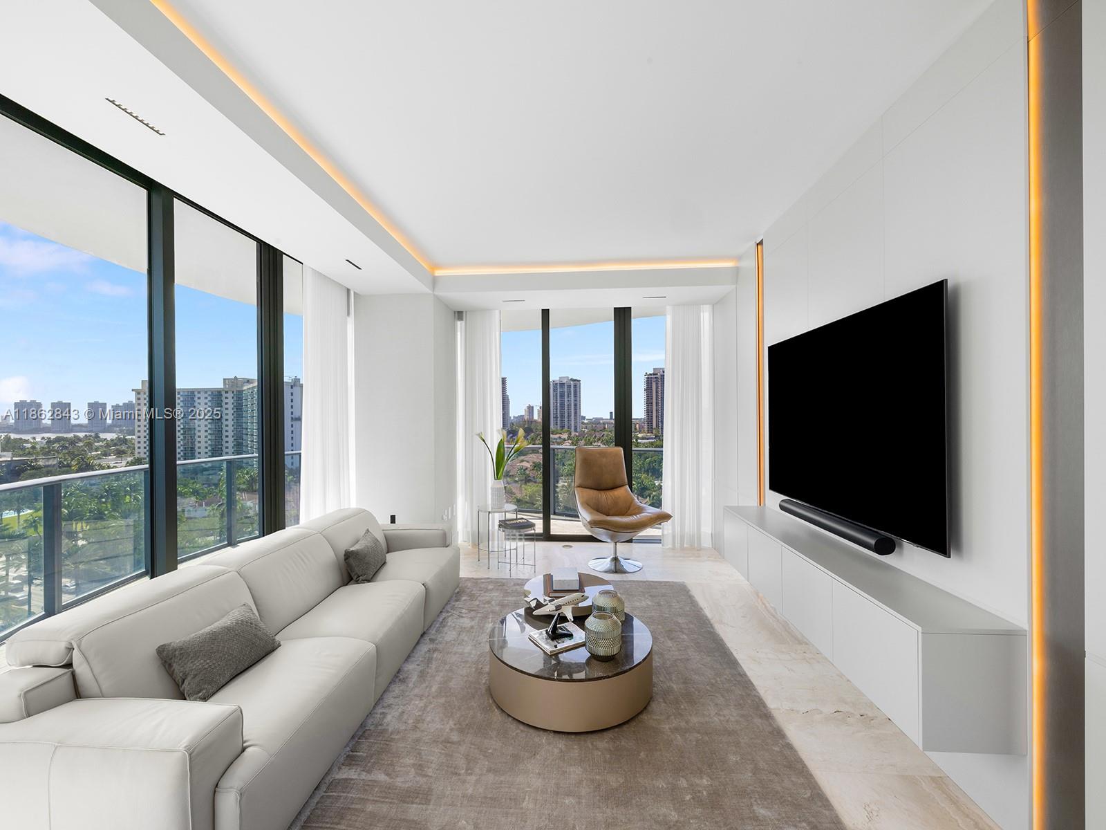 19575 Collins Avenue, Unit 9 Sunny Isles Beach, FL 33160 - Photo 36 of 91 a living room with furniture and a flat screen tv