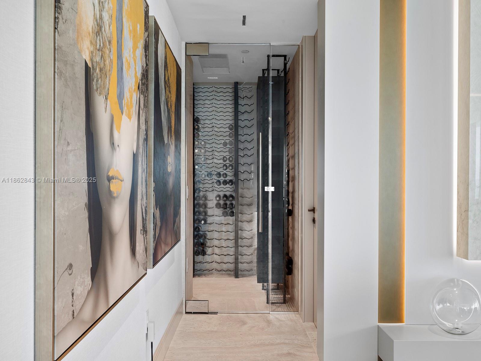 19575 Collins Avenue, Unit 9 Sunny Isles Beach, FL 33160 - Photo 59 of 91 a view of a hallway with wooden floor and glass door
