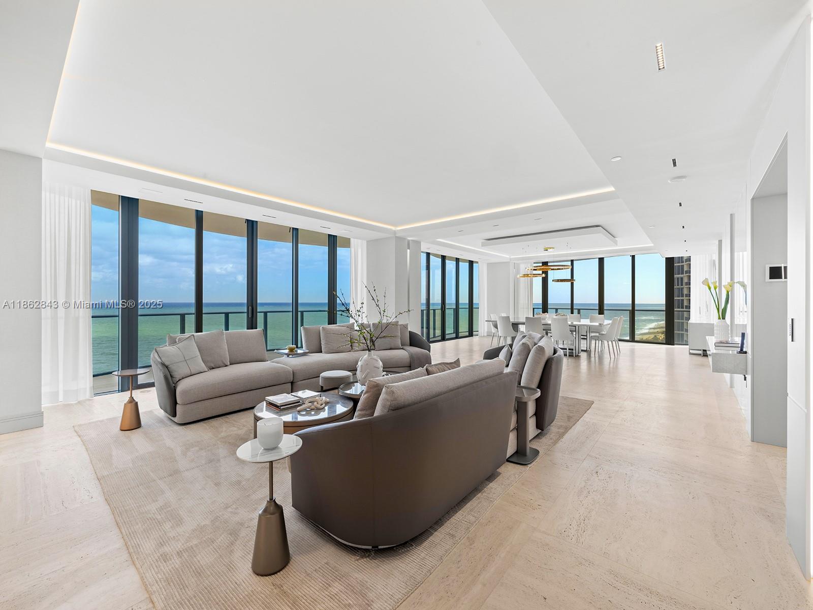 19575 Collins Avenue, Unit 9 Sunny Isles Beach, FL 33160 - Photo 7 of 91 a living room with furniture and a large window