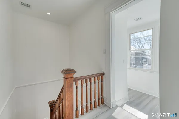 a view of a hallway with windows
