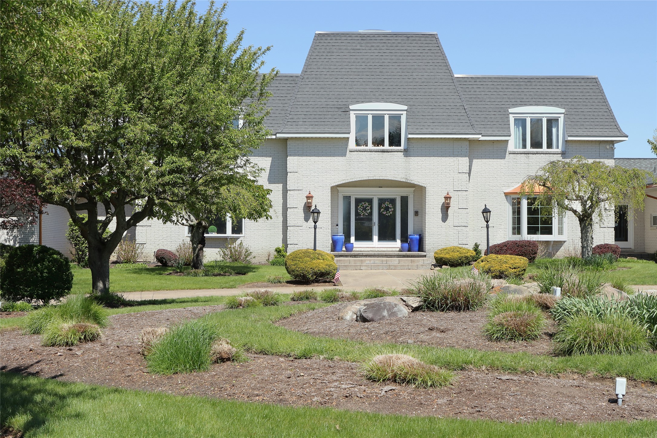 Front of Home to Entrance and Foyer