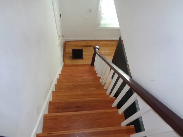 a room with lots of books and chairs