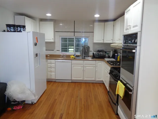 a view of a fireplace with wooden floor