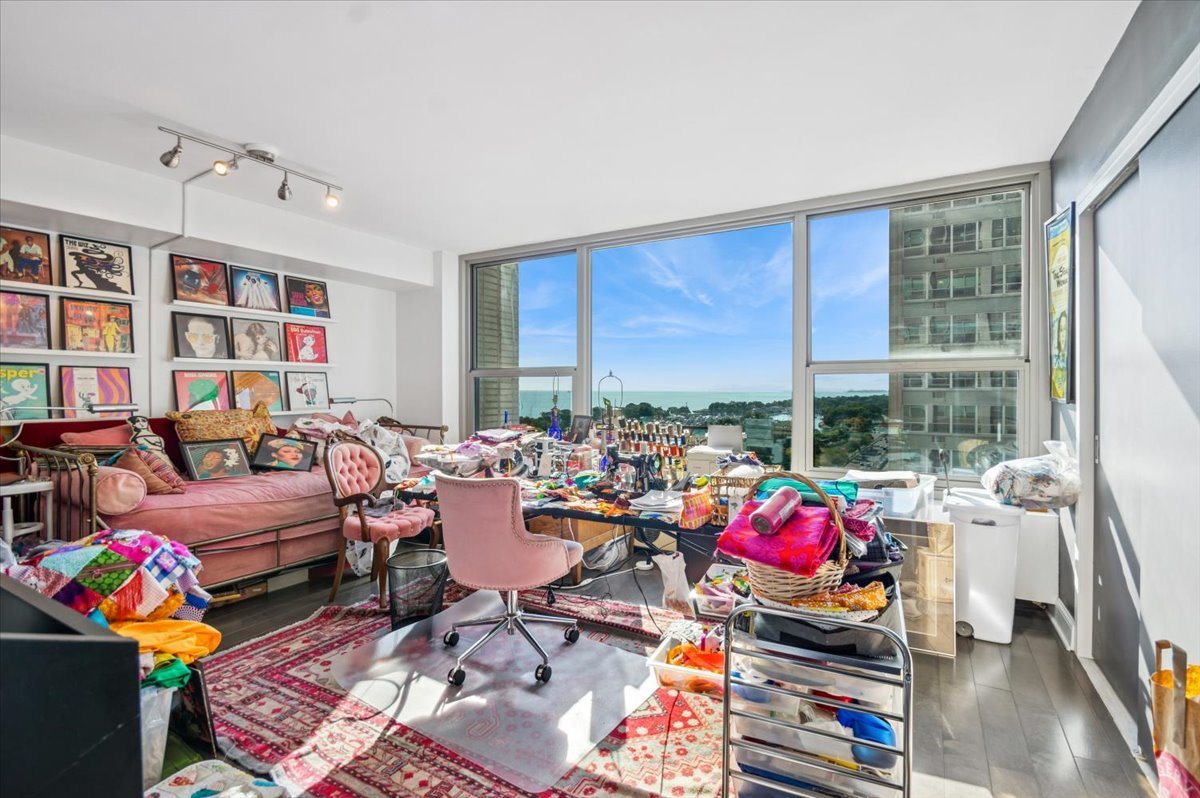 3600 North Lake Shore Drive, Unit 1601 Chicago, IL 60613 - Photo 15 of 16 a living room with furniture toys and a large window