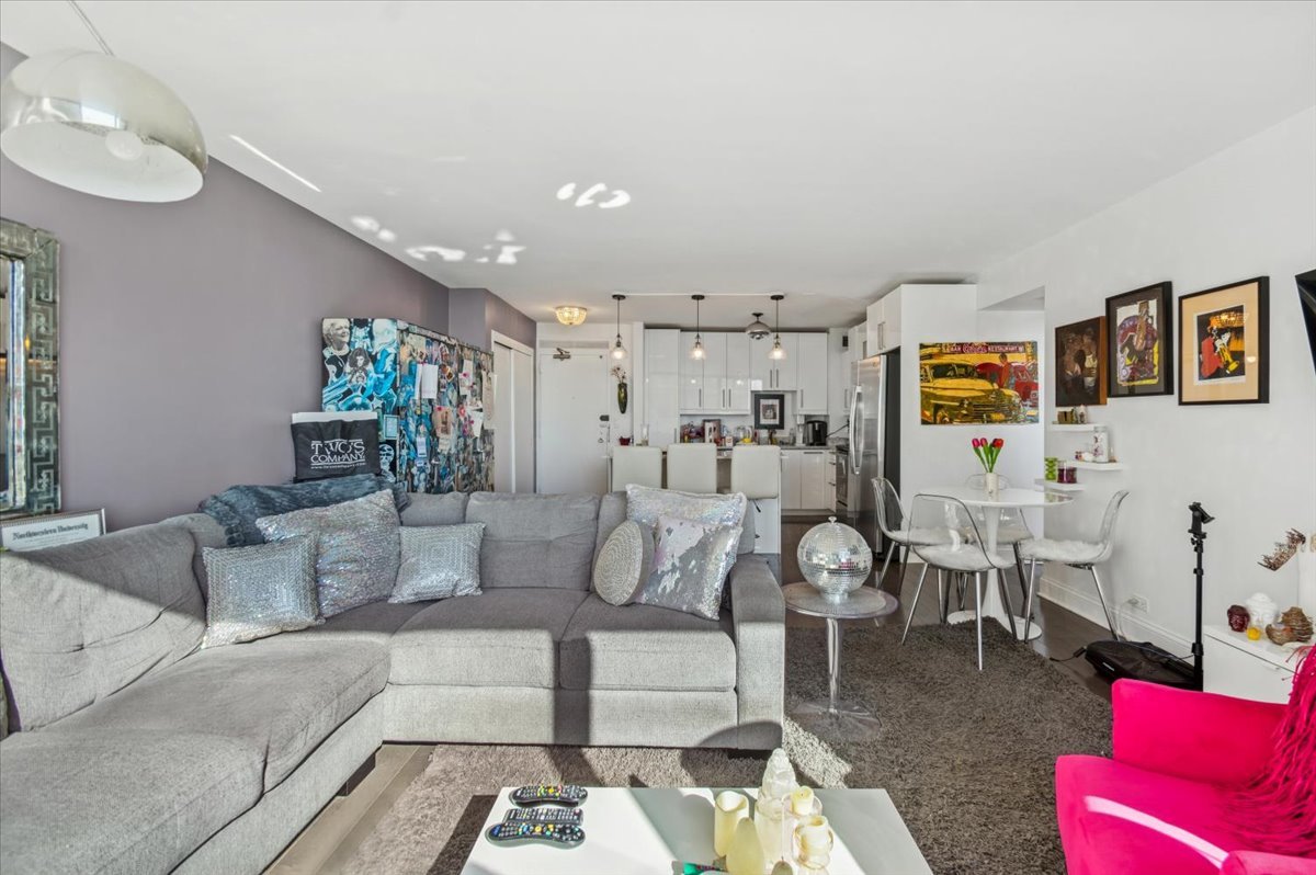 3600 North Lake Shore Drive, Unit 1601 Chicago, IL 60613 - Photo 9 of 16 a living room with furniture and a large window