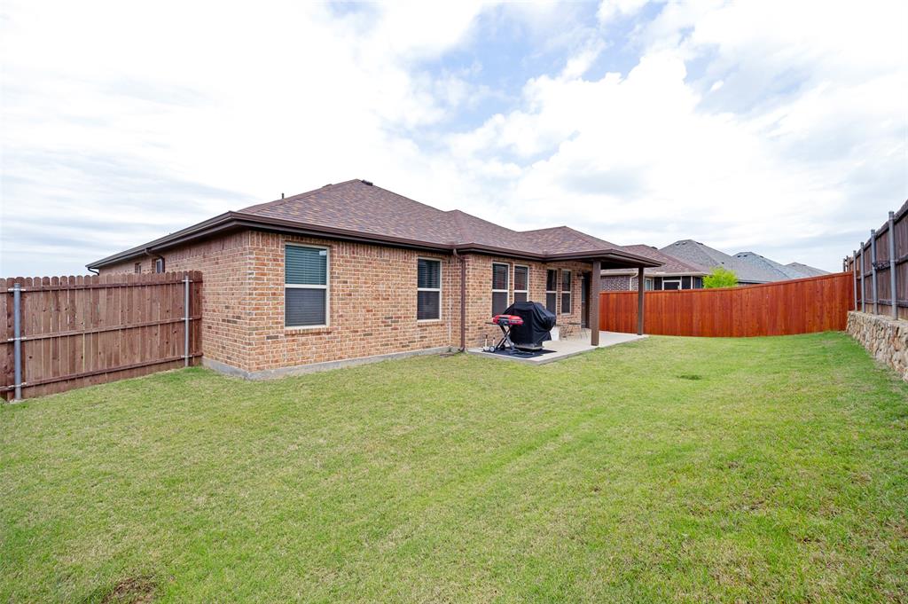 3905 Bridle Path Lane Sanger, TX 76266 - Photo 24 of 26 a view of a house with a yard and sitting area
