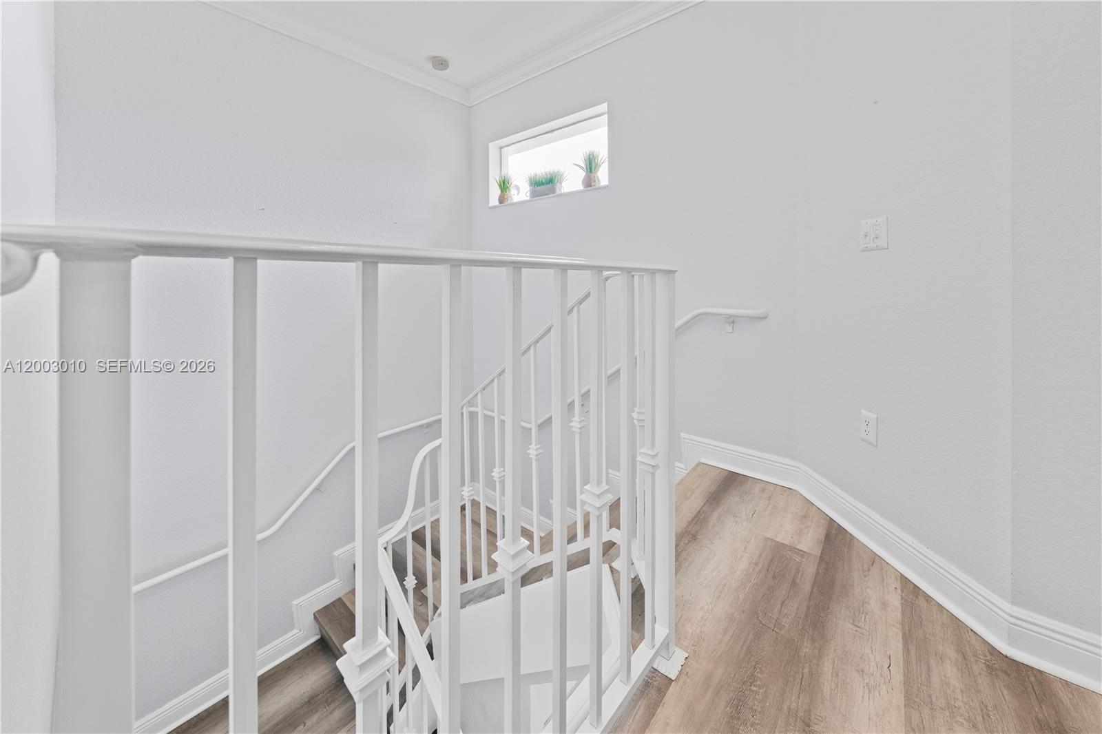 7452 Northwest 178th Street Hialeah, FL 33015 - Photo 11 of 28 a view of staircase with white walls and a window