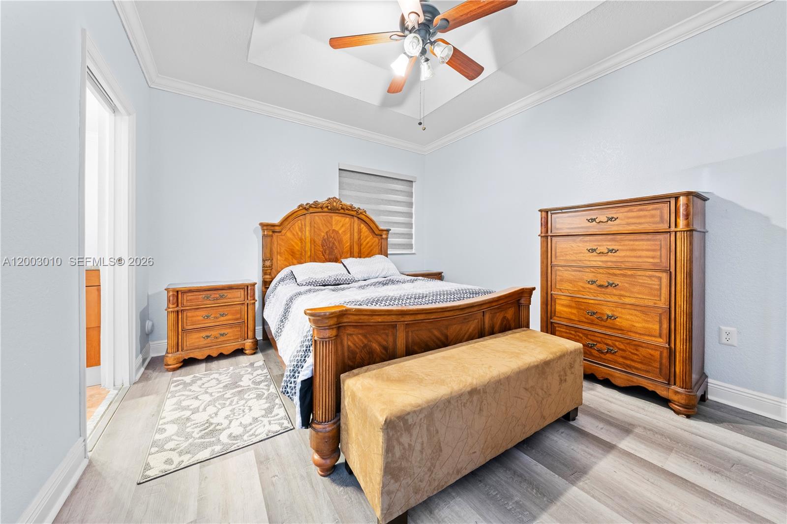 7452 Northwest 178th Street Hialeah, FL 33015 - Photo 16 of 28 a bedroom with a bed and wooden floor
