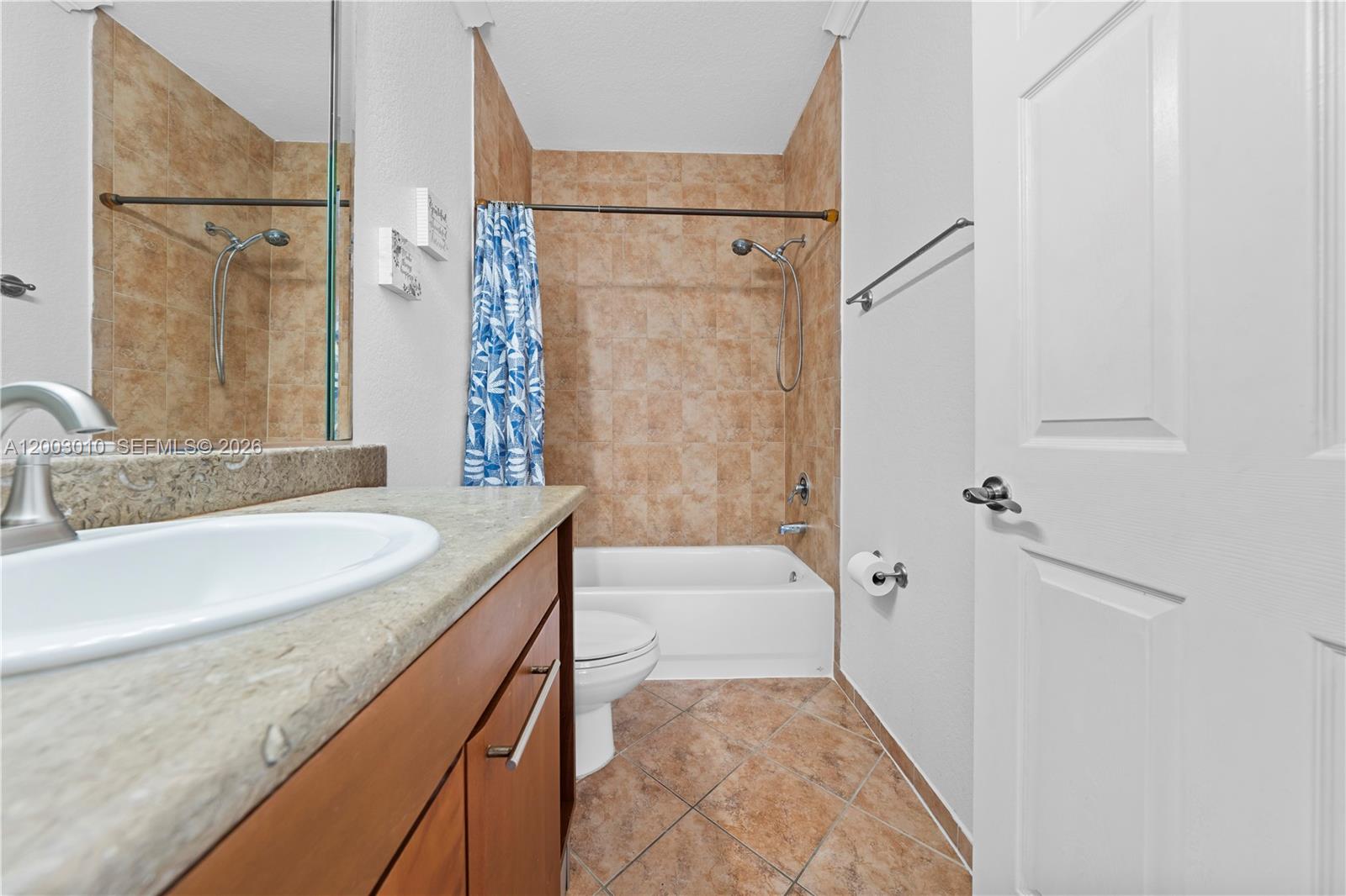 7452 Northwest 178th Street Hialeah, FL 33015 - Photo 17 of 28 a bathroom with a tub sink and mirror