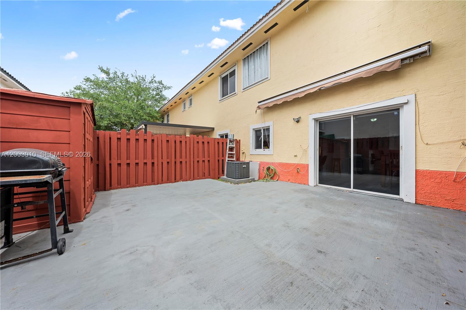 7452 Northwest 178th Street Hialeah, FL 33015 - Photo 19 of 28 a view of the house with wooden floor and fence