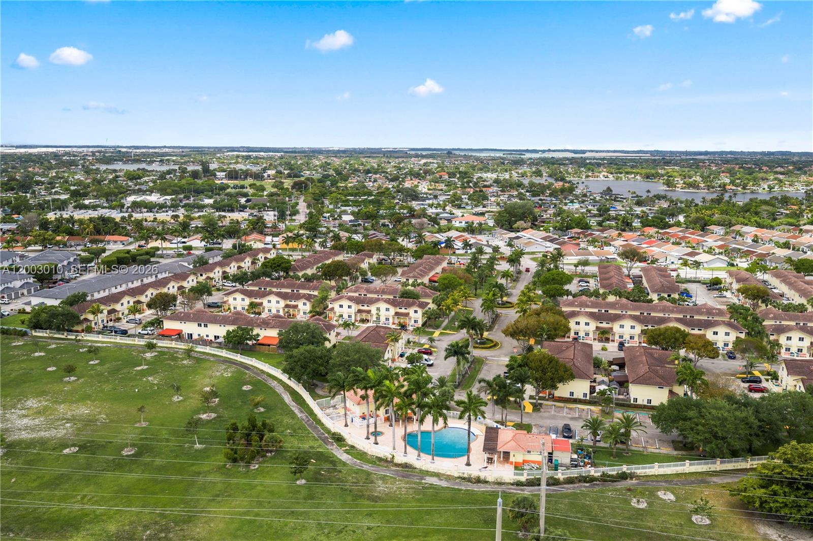 7452 Northwest 178th Street Hialeah, FL 33015 - Photo 26 of 28 an aerial view of residential houses with outdoor space and swimming pool