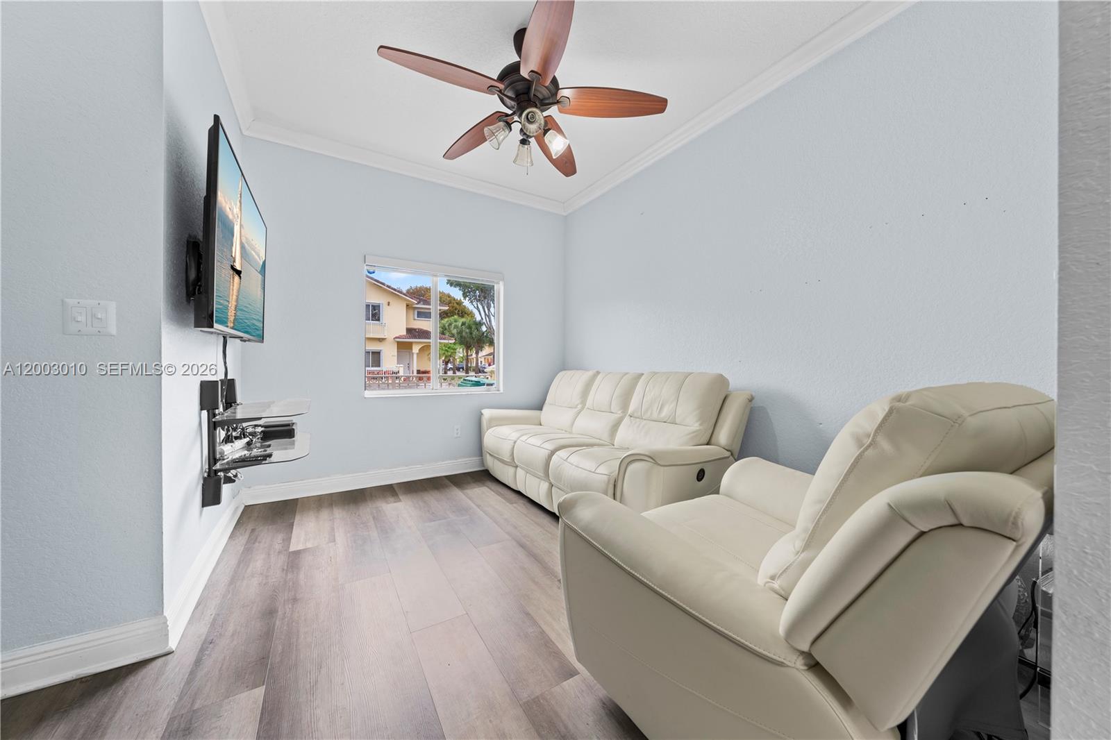 7452 Northwest 178th Street Hialeah, FL 33015 - Photo 4 of 28 a living room with furniture and a window