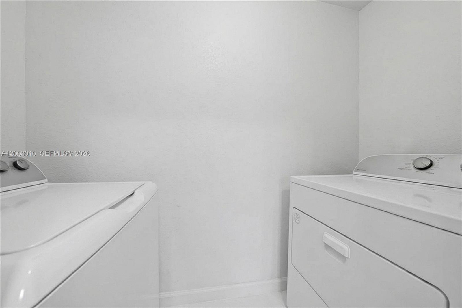 7452 Northwest 178th Street Hialeah, FL 33015 - Photo 8 of 28 a utility room with dryer and washer