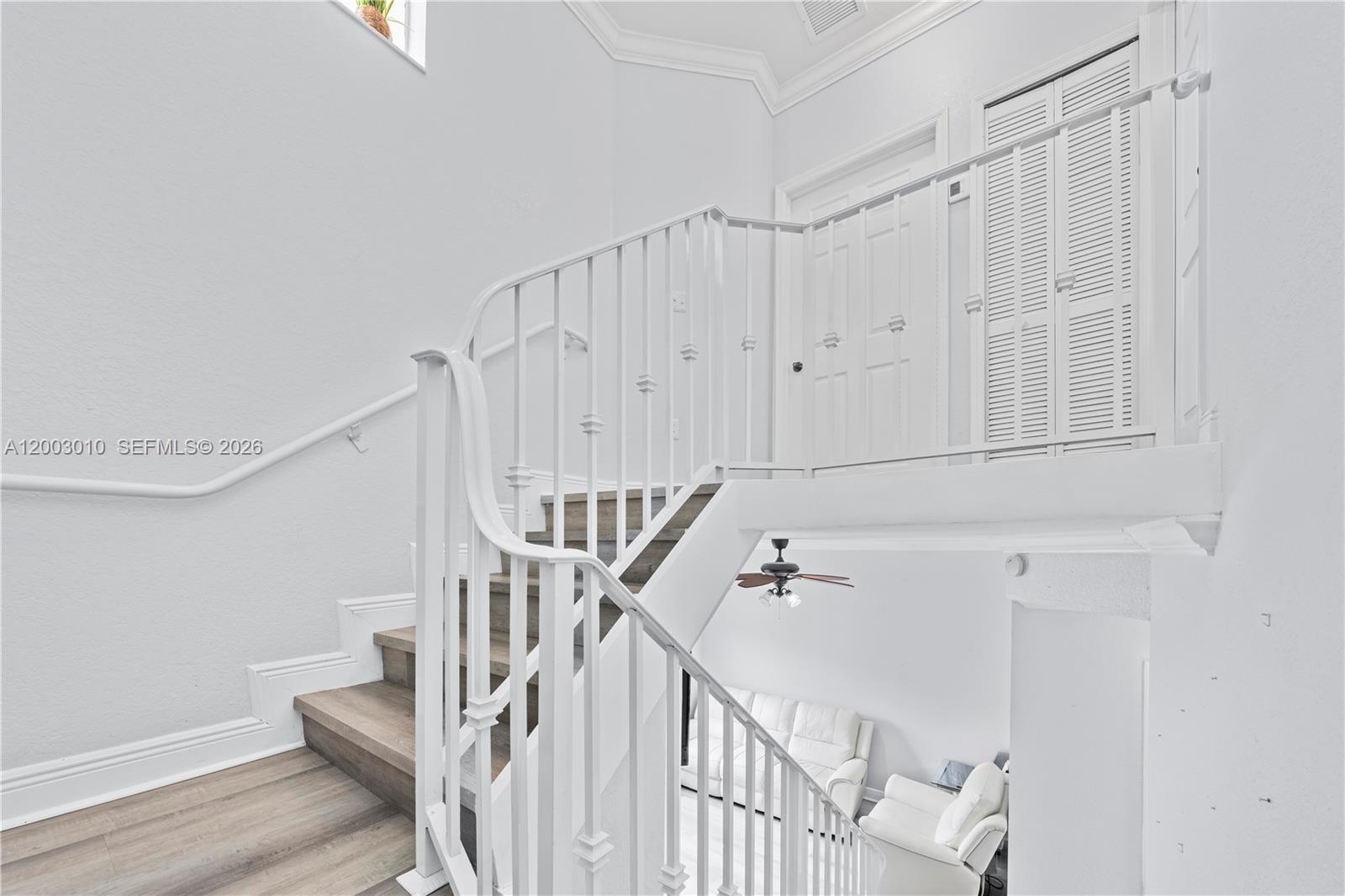7452 Northwest 178th Street Hialeah, FL 33015 - Photo 10 of 28 a view of staircase with white walls and white walls
