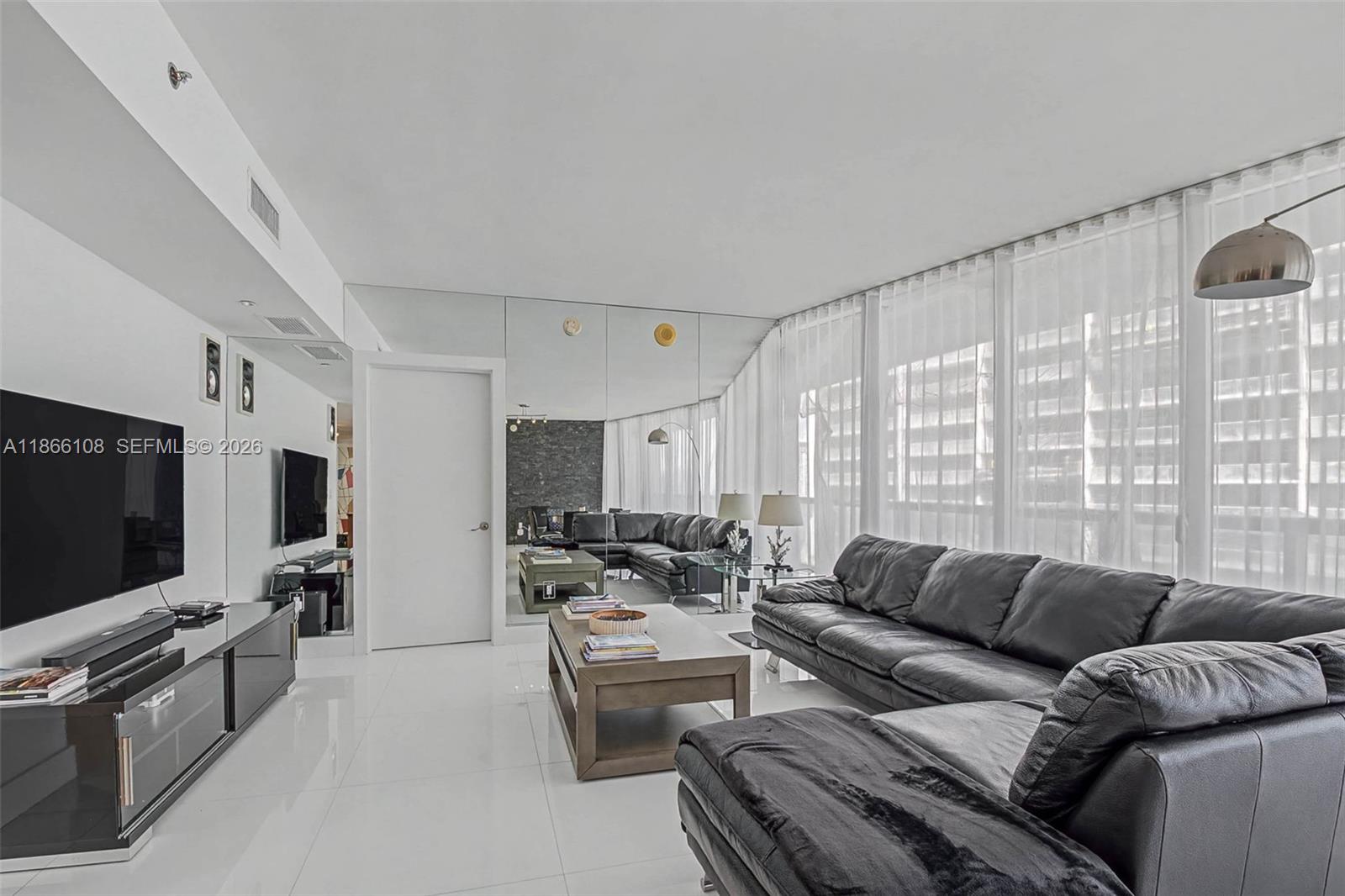 495 Brickell Avenue, Unit 3504 Miami, FL 33131 - Photo 19 of 43 a living room with furniture and a flat screen tv