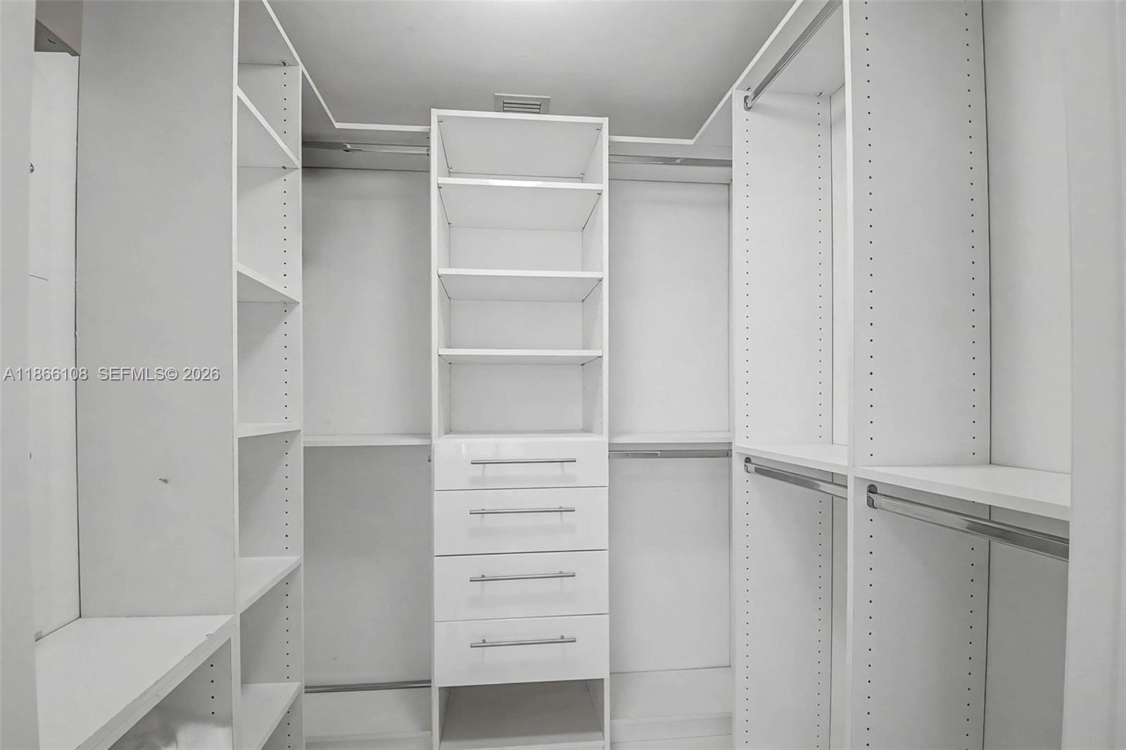 495 Brickell Avenue, Unit 3504 Miami, FL 33131 - Photo 21 of 43 a view of walk in closet with empty racks