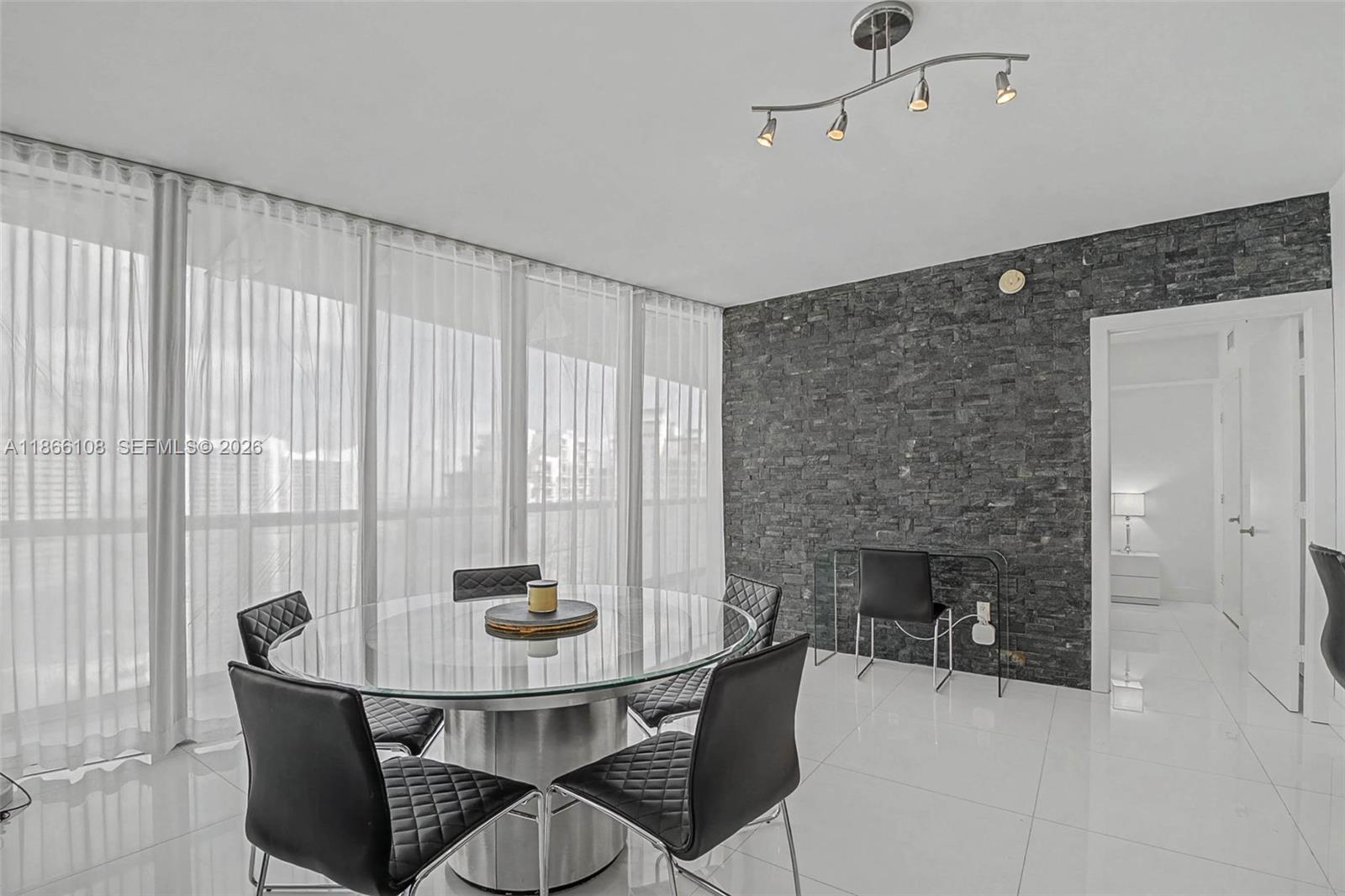 495 Brickell Avenue, Unit 3504 Miami, FL 33131 - Photo 23 of 43 a dining room with furniture and window
