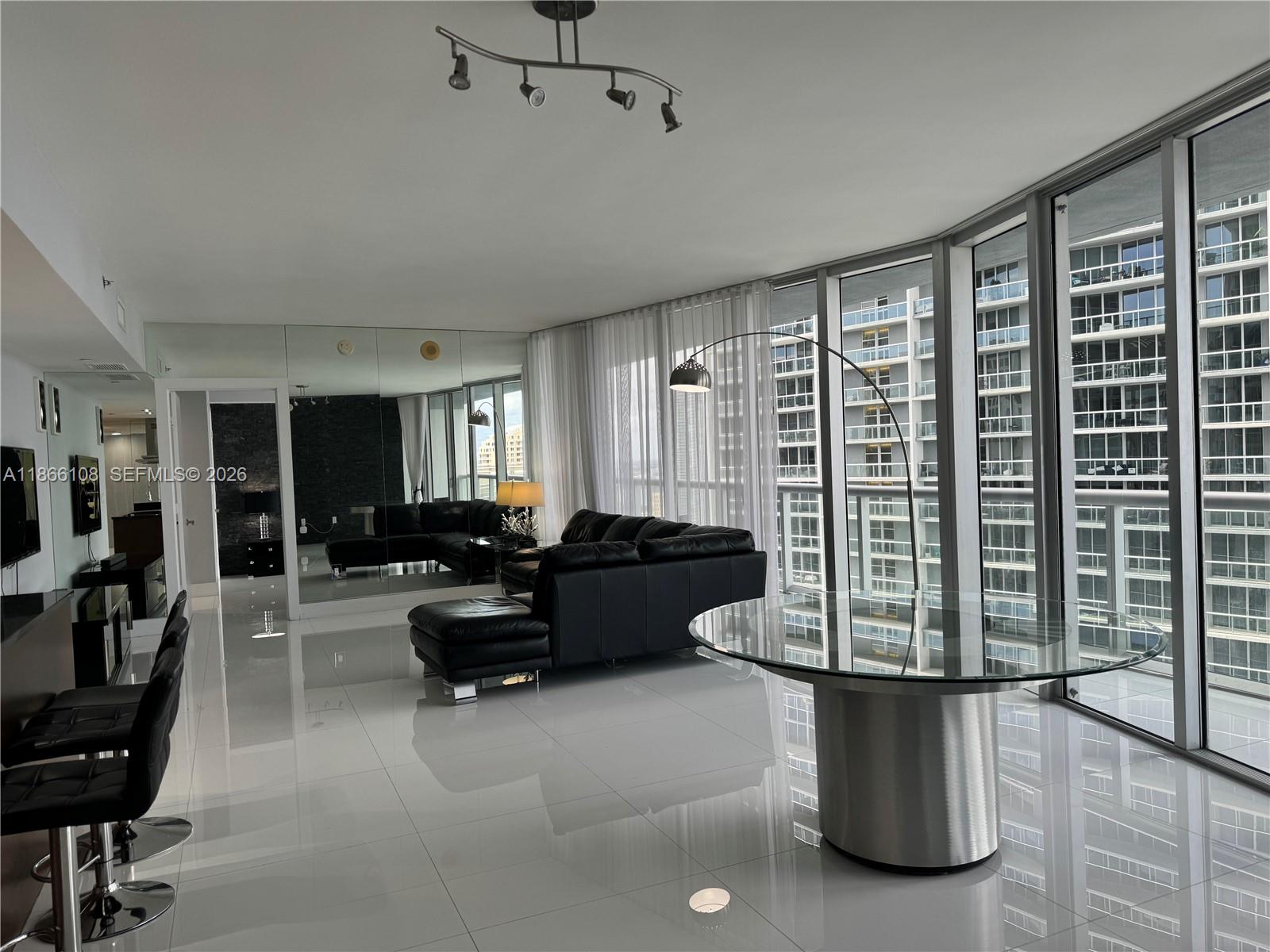 495 Brickell Avenue, Unit 3504 Miami, FL 33131 - Photo 28 of 43 a living room with furniture and a large window