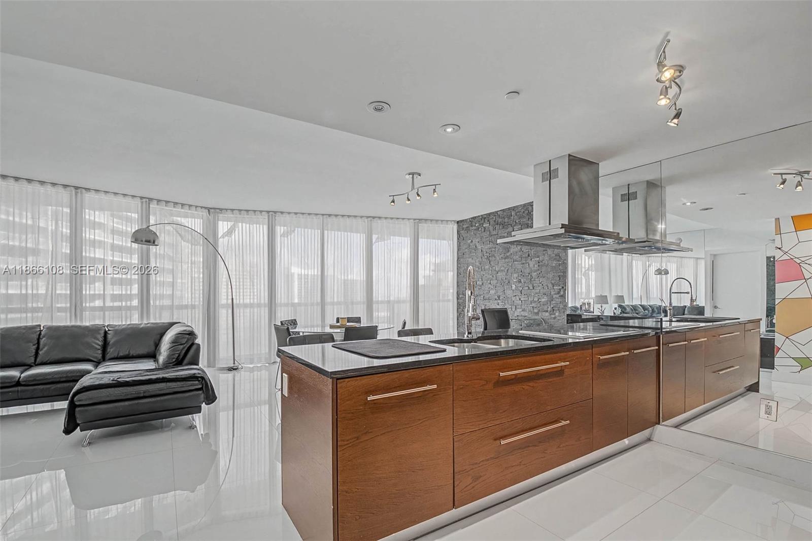 495 Brickell Avenue, Unit 3504 Miami, FL 33131 - Photo 3 of 43 a kitchen with stainless steel appliances a sink stove and cabinets