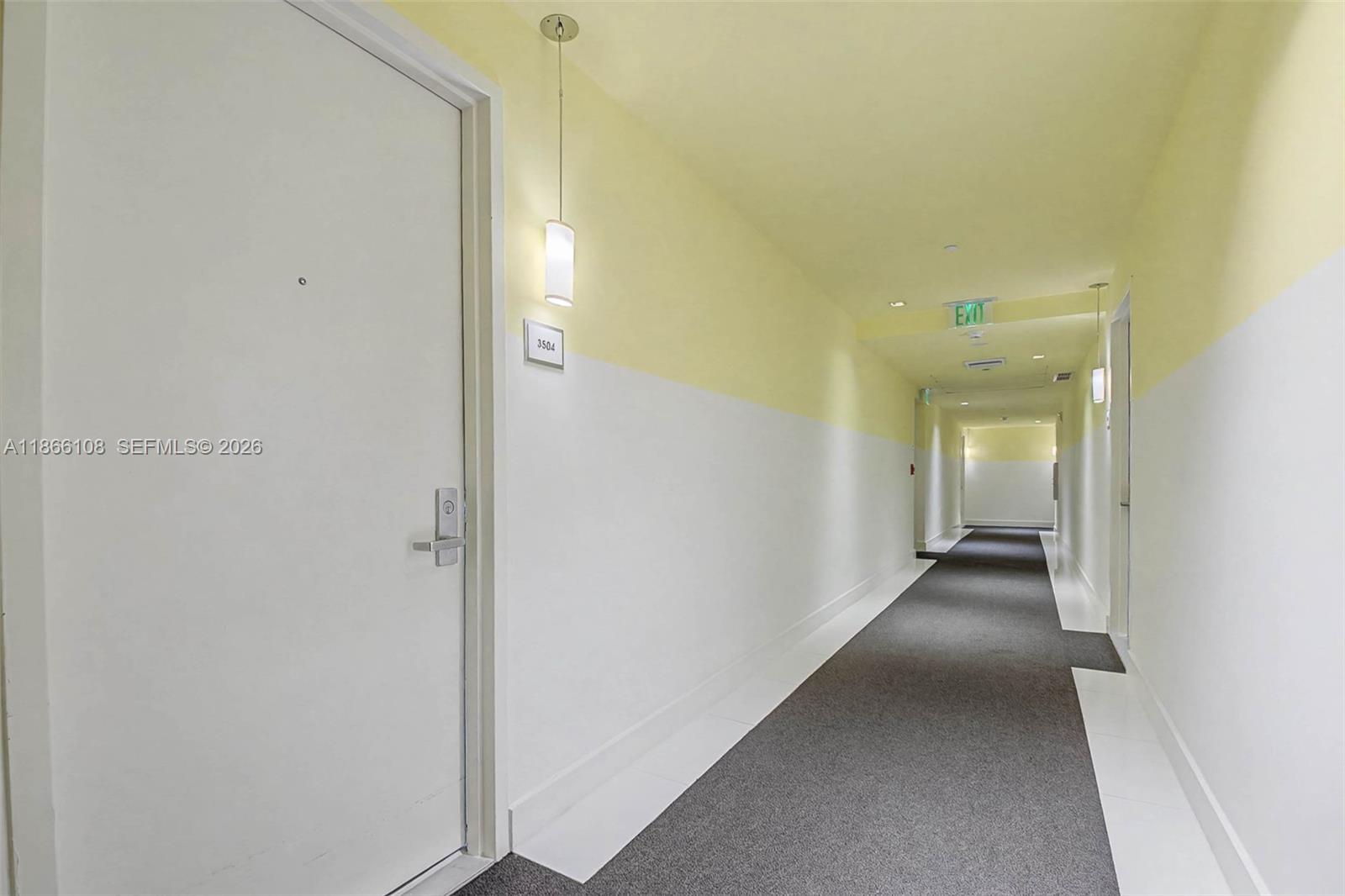 495 Brickell Avenue, Unit 3504 Miami, FL 33131 - Photo 32 of 43 a view of a hallway with wooden floor