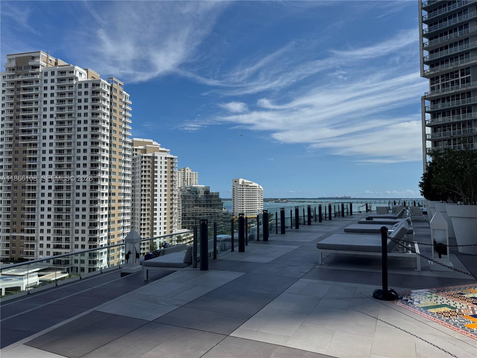 495 Brickell Avenue, Unit 3504 Miami, FL 33131 - Photo 40 of 43 a roof deck with table and chairs