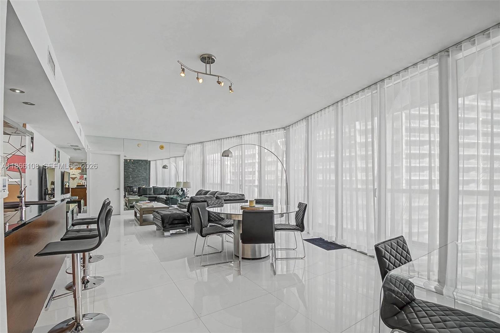 495 Brickell Avenue, Unit 3504 Miami, FL 33131 - Photo 4 of 43 a living room with furniture and a large window