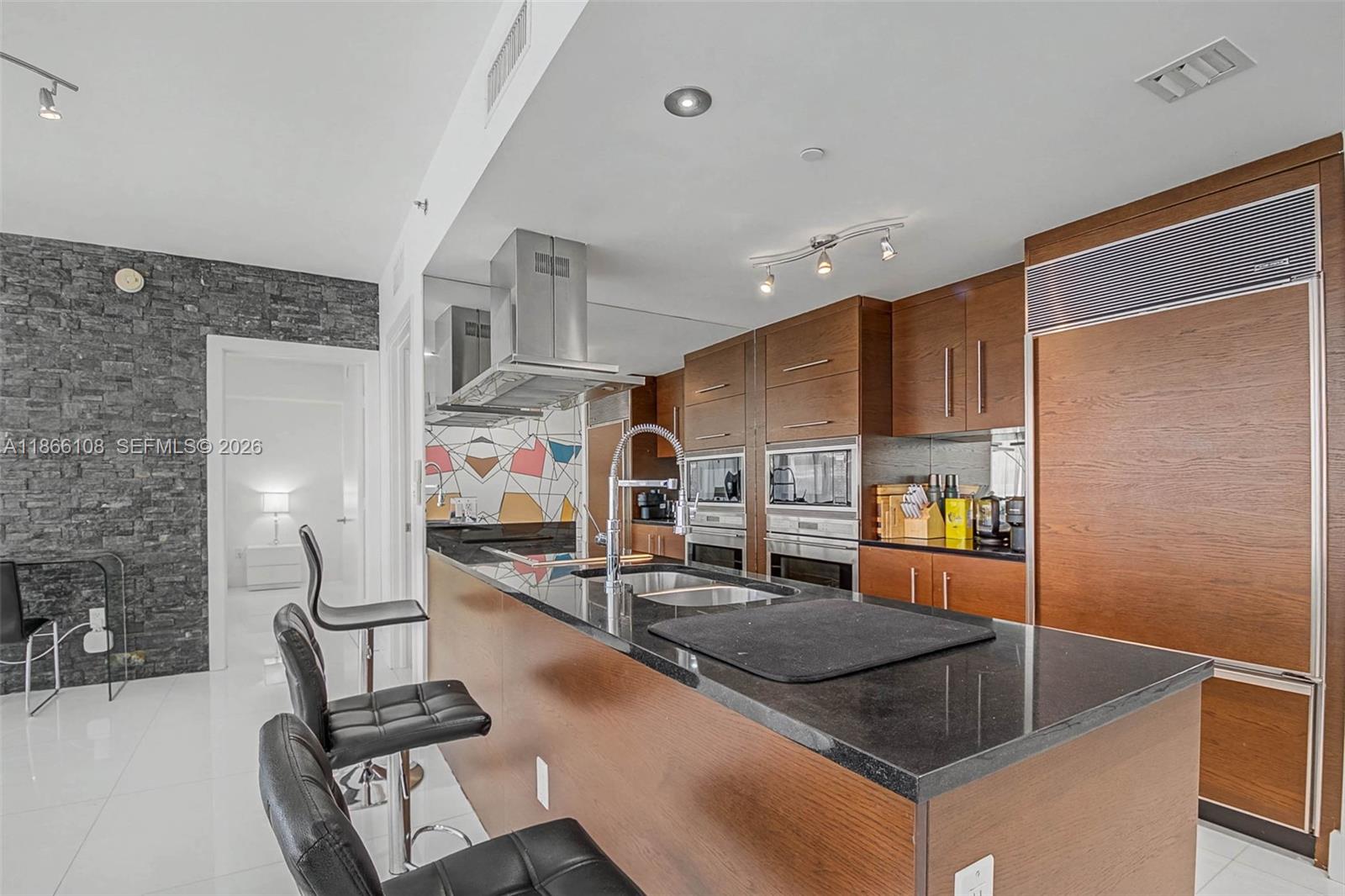 495 Brickell Avenue, Unit 3504 Miami, FL 33131 - Photo 6 of 43 a kitchen with stainless steel appliances granite countertop a sink a stove and a refrigerator