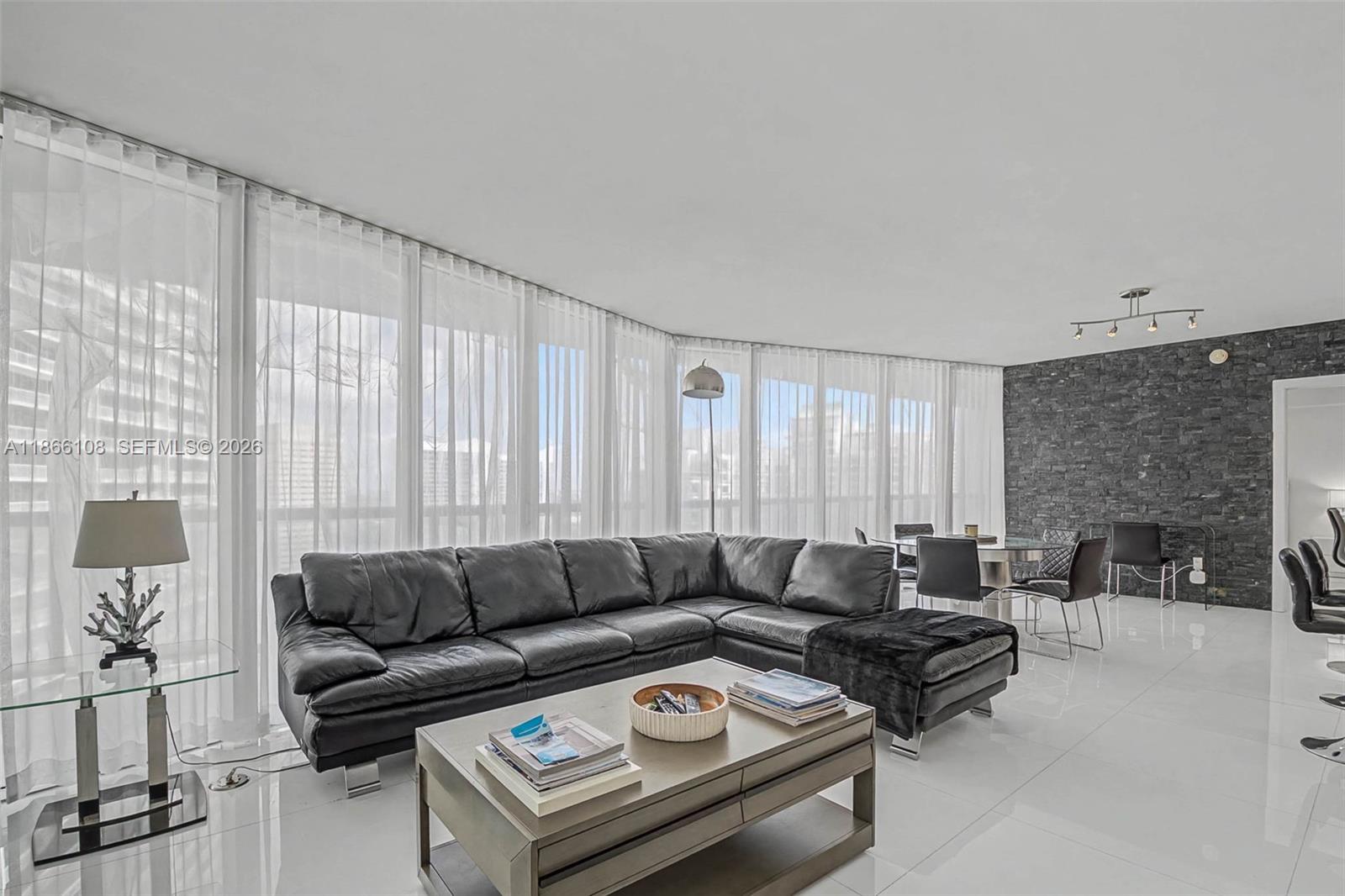 495 Brickell Avenue, Unit 3504 Miami, FL 33131 - Photo 8 of 43 a living room with furniture and a fireplace