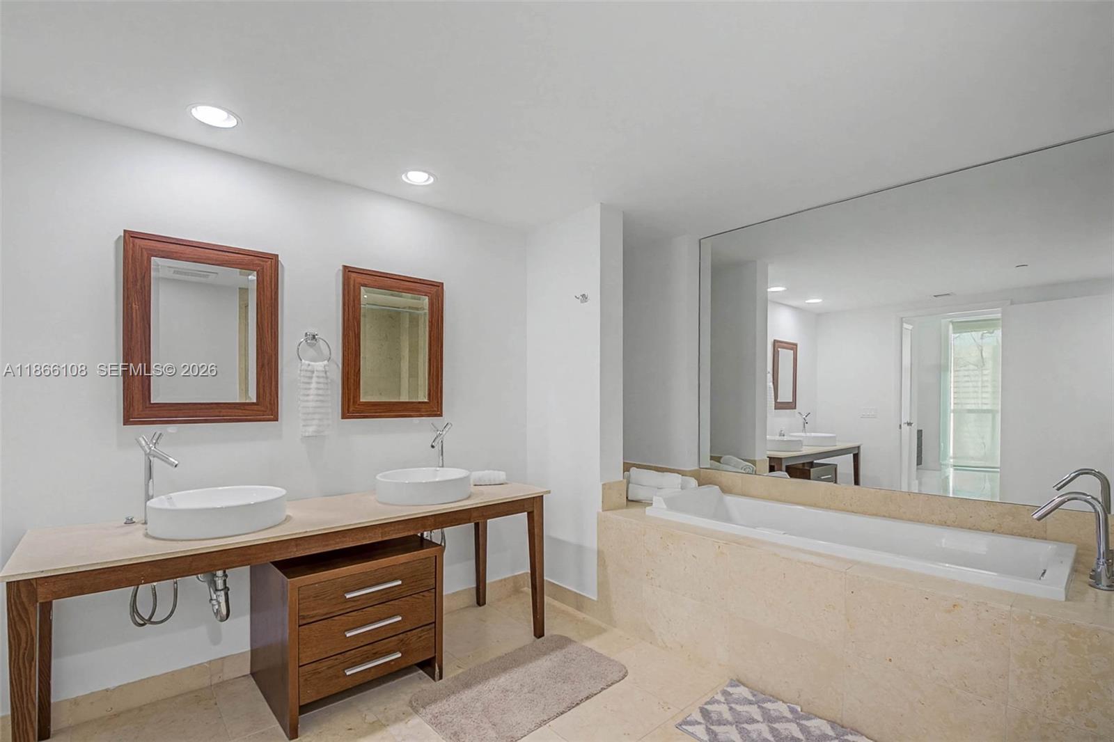 495 Brickell Avenue, Unit 3504 Miami, FL 33131 - Photo 9 of 43 a bathroom with a sink double vanity and a mirror