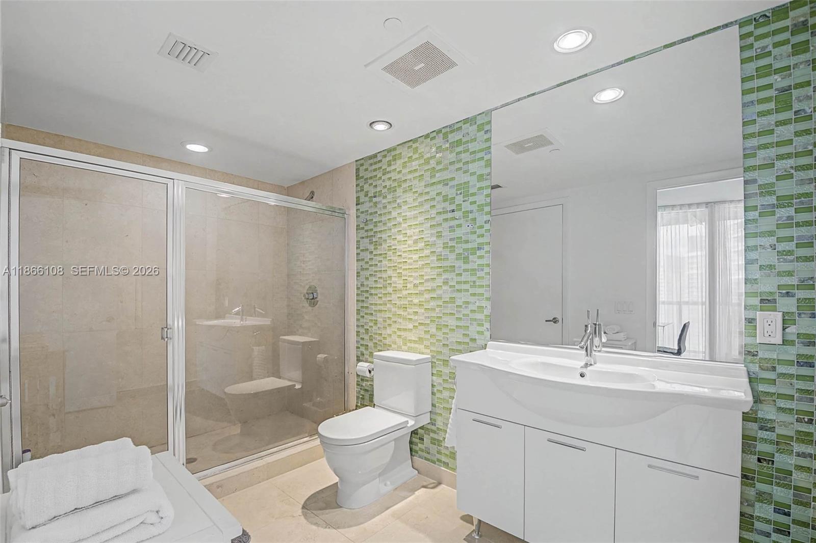 495 Brickell Avenue, Unit 3504 Miami, FL 33131 - Photo 10 of 43 a bathroom with a sink toilet and shower